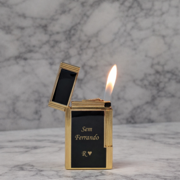 Vuursteenaansteker Jean Claude Dustin goud zwart met bedrukking