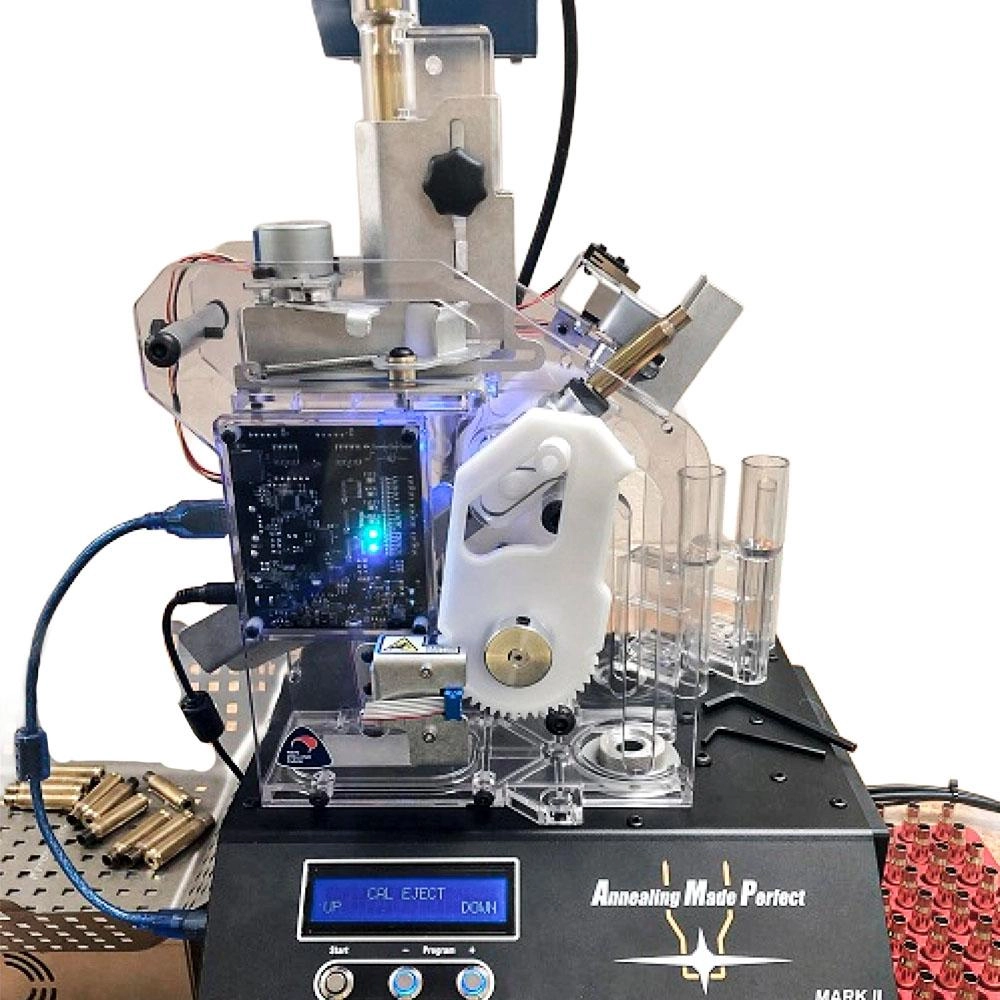 AMP MATE auto feeder mounted on an AMP annealer with case feed tubes