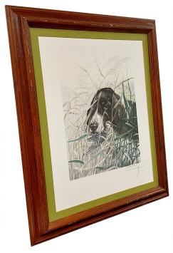 Zwart-witte spaniël met watersnip