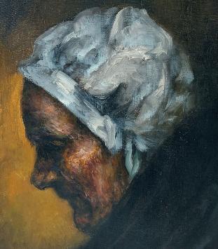 De Mechelse kunstenaar Ignace Kennis met een gesigneerd schilderij