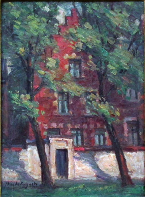 Belgische kunstschilder Julien Van de Veegaete met een schilderij