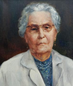 De Mechelse kunstenaar Ignace Kennis met een portretschilderij