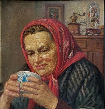 Belgische kunstschilder Jean Laenen met een olieverfschilderij
