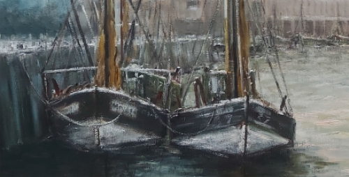 Vissersboten in de haven aan de kade