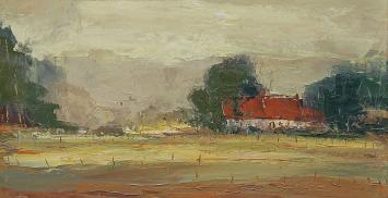 Kunstschilder Juul Keppens met een schilderij van een landschap
