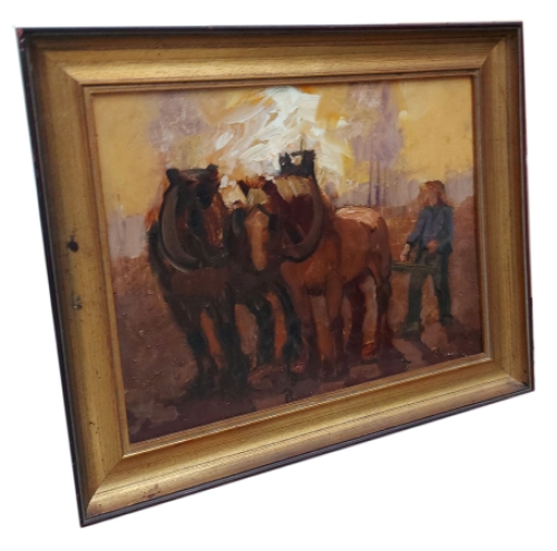 Twee trekpaarden met de boer in het veld