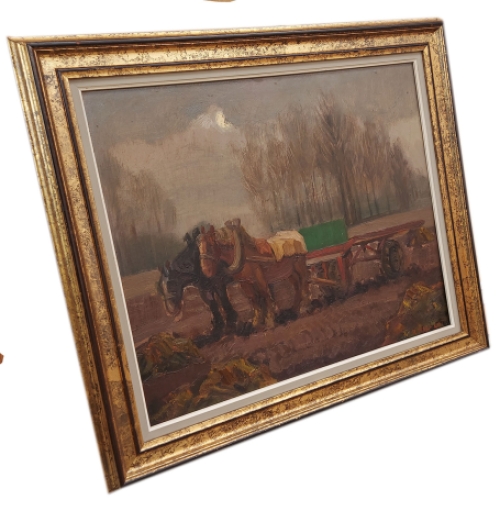 Twee Brabantse trekpaarden aan een kar in het veld