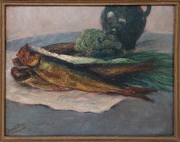 Romain Steppe met een schilderij ban twee bruine haringen